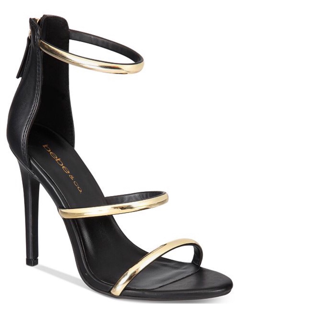 Black heels w/ gold straps, never worn, no box.